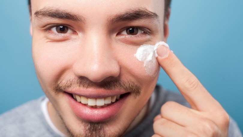 Man Applying Cream Istock