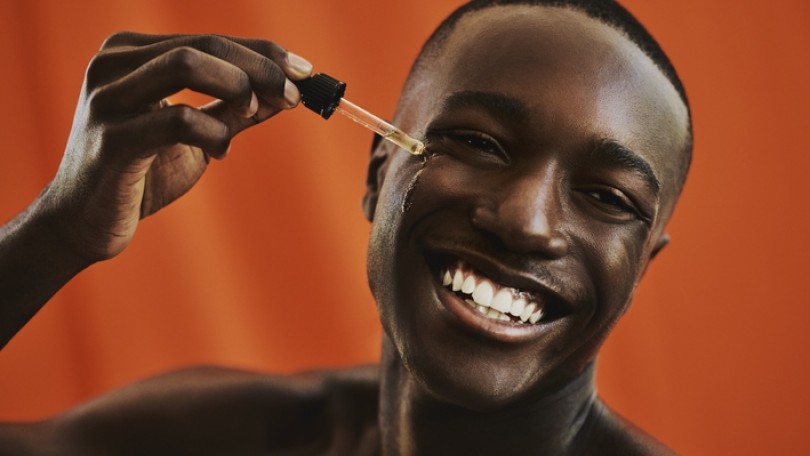 Man Applying Serum Istock